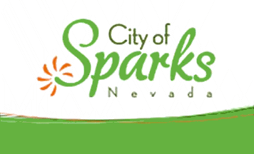 City of Sparks logo with green script text and orange sunburst accent on white background for Sparks, NV